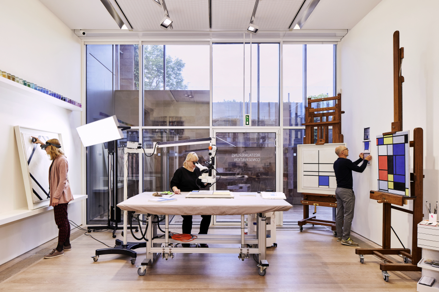 people in art conservation lab