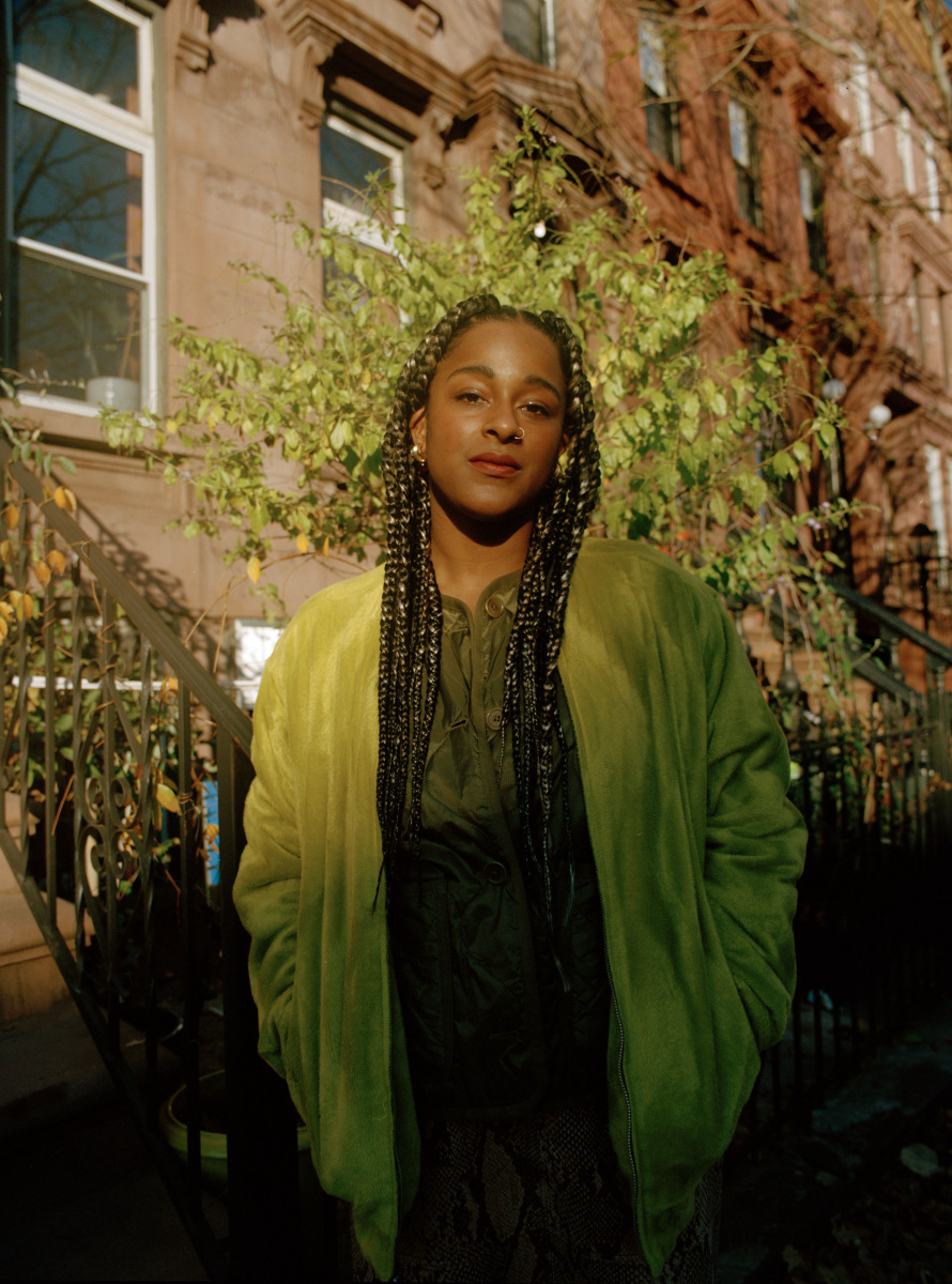 woman in green coat outside