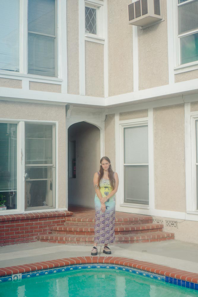 woman standing by pool