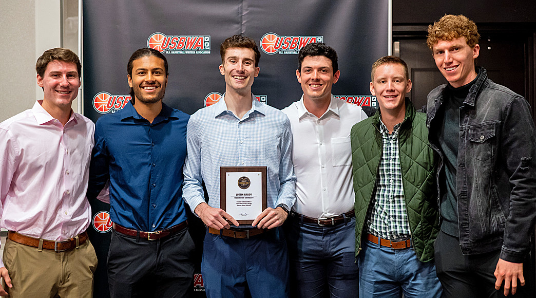 Surrounded by his Washington University teammates, Justin Hardy was presented with the Perry Wallace Courage Award this past April in New Orleans.